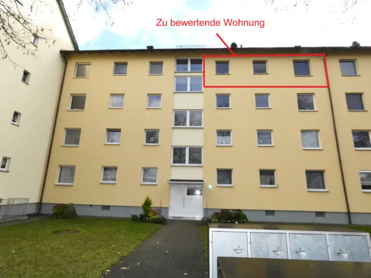 Front facade of residential building - unit marked in red