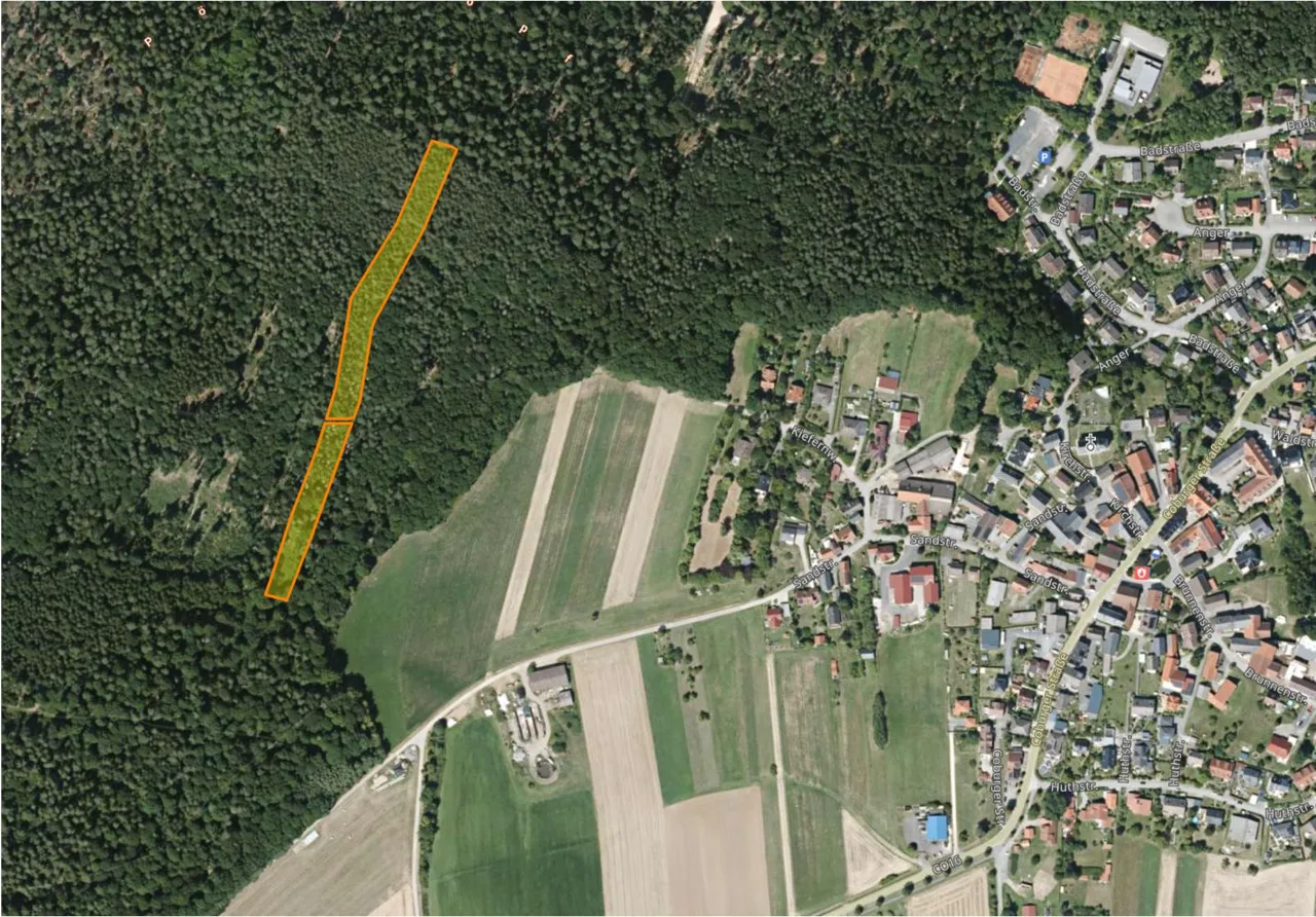 Aerial view of property with marked cadastral parcel